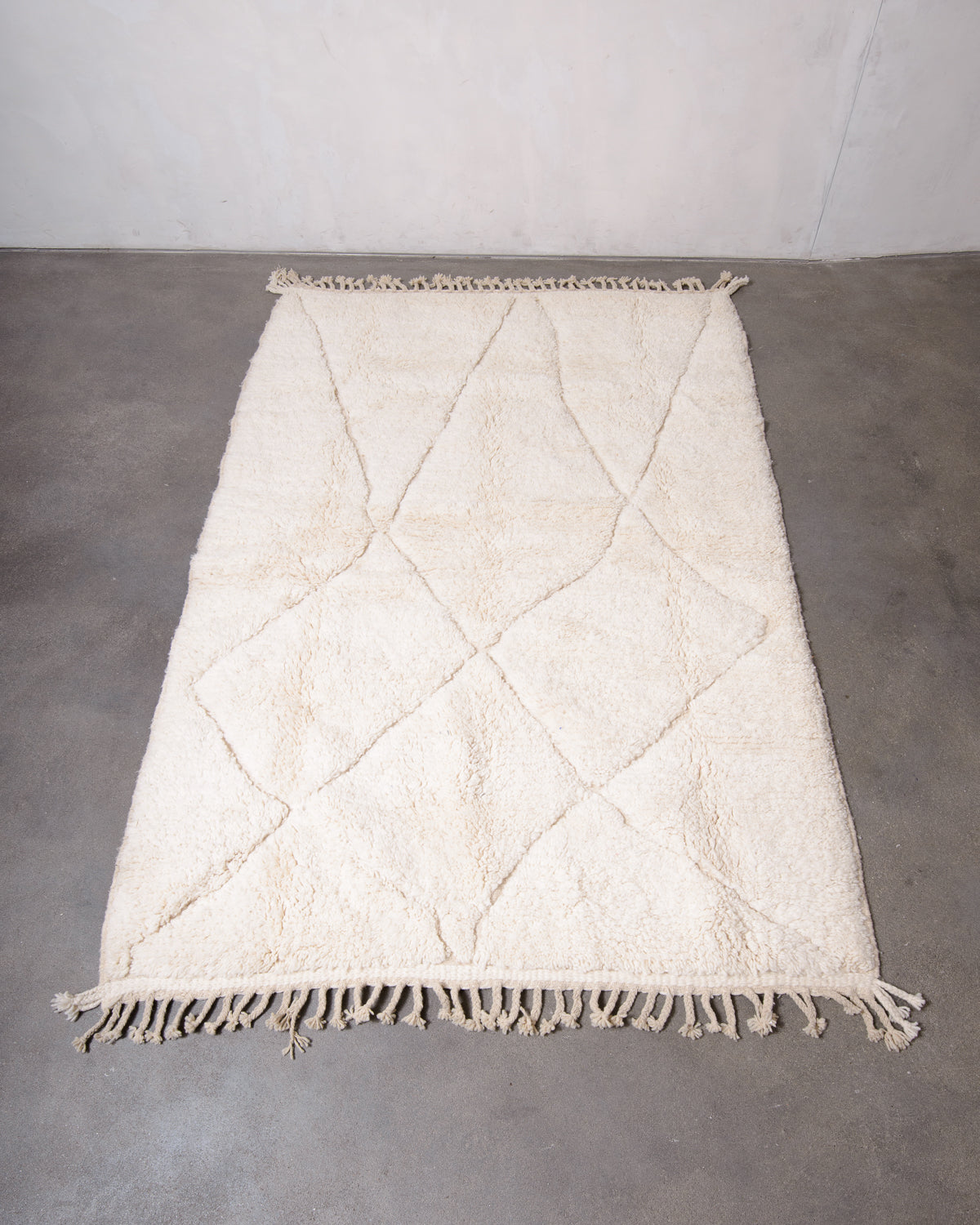 Modern, designer, handcrafted Berber rug from Morocco. Beniourain carpet with minimalist design, natural wool pile and a fluffy texture.
